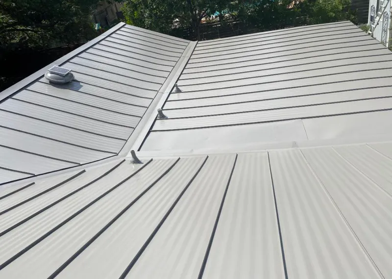 Solar attic fan installed on a metal roof for Roof Ventilation in South Jordan
